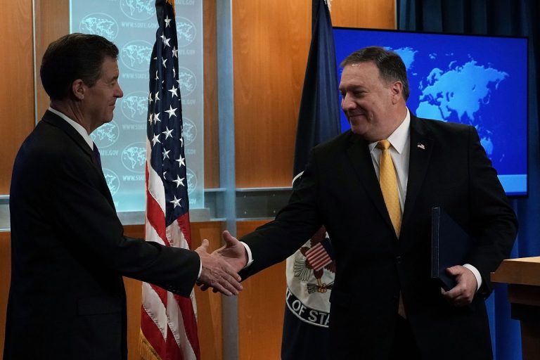 U.S. Secretary of State Mike Pompeo (R) shakes hands with State Department Ambassador at Large for International Religious Freedom Sam Brownback (L) during a press event at the State Department May 29, 2018 in Washington, DC. The State Department held the event to release of the 2017 Annual Report on International Religious Freedom. 