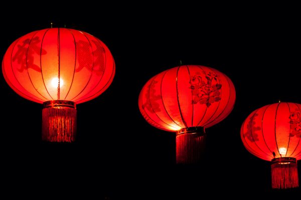 3 red chinese lanterns in the night