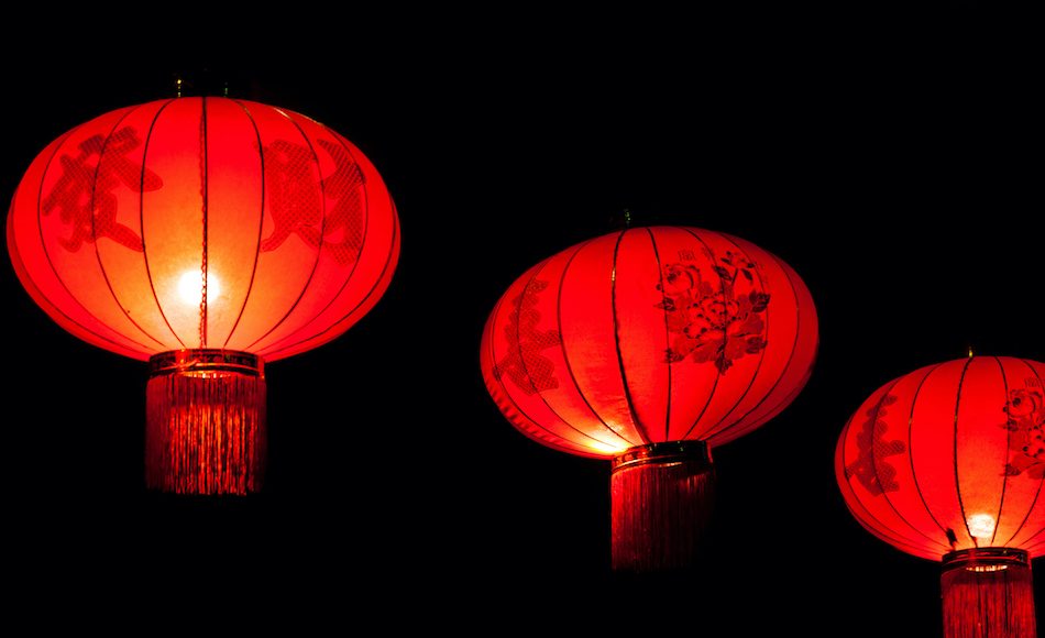 3 red chinese lanterns in the night