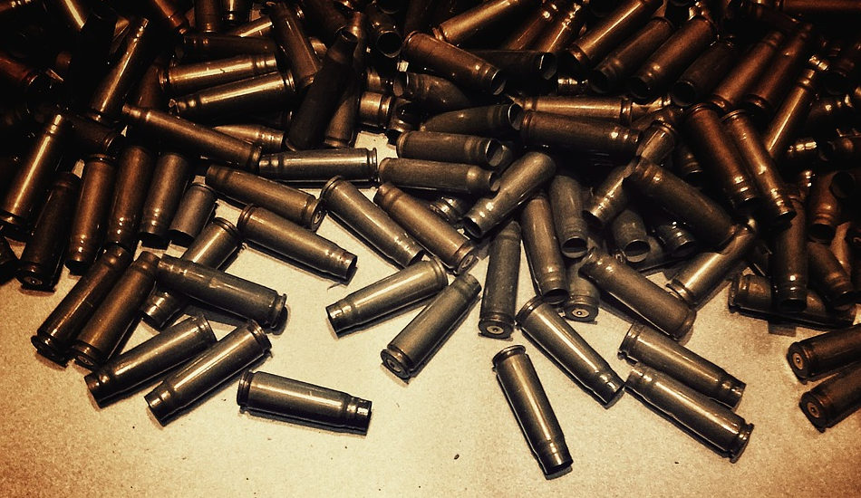 A pile of empty shell casings for bullets.