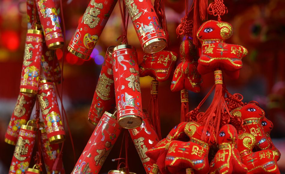 detail of firecrackers and red trinkets to keep away chinese new year monster nian