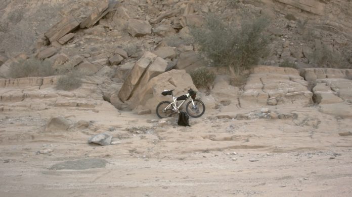 Mountain bike in rocky landscape.