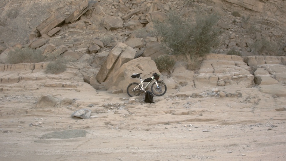Mountain bike in rocky landscape.