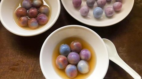 Tang Yuan served in white bowls and yellow sugar broth