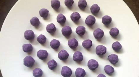 purple ube balls for the recipes stuffing on white plate