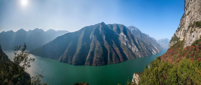 Yangzte River China and the mountain with some leaves turning red.