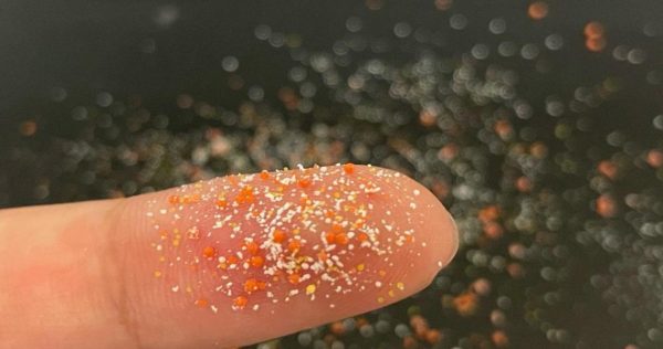 Microplastics on a finger.