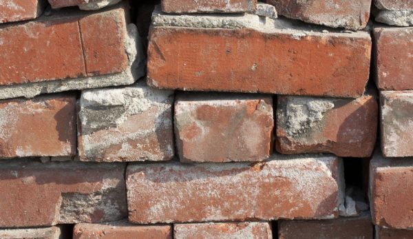 A close up of an old pile of bricks.