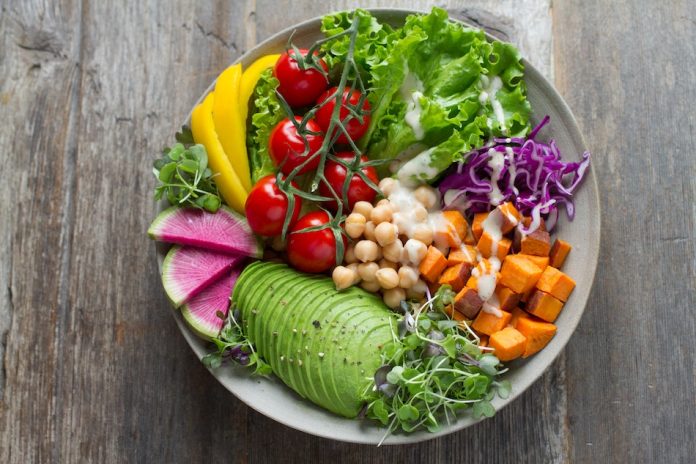 colourful salad and avocado and chickpeas pumpkin tomato lettuce red cabbage yellow peppers