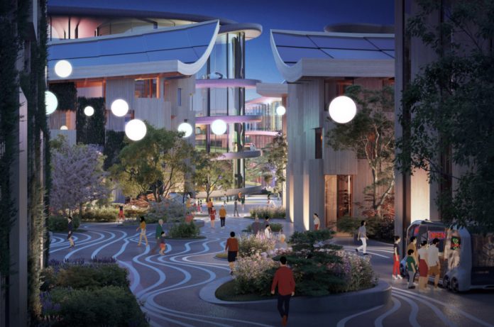 Artist's rendering of Toyota's woven city with some people walking on the streets at night while others stand in line in front of an autonomous vehicle equipped as a mobile food truck.
