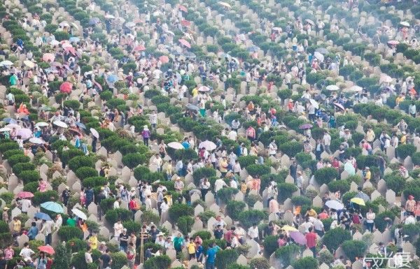 The cemeteries are full of people remembering the dead. Birdseye view photo.