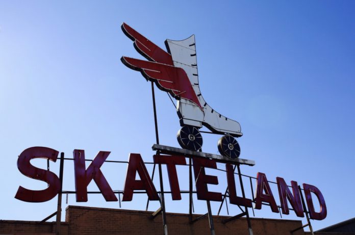 Old now closed Skateland neon sign on the Skateland roller skating rink building.