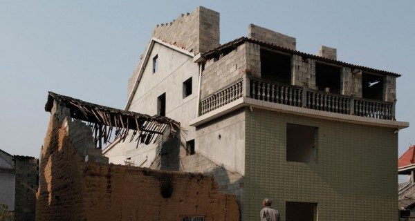 A man from the village requesting a photo of him before his homes are demolished.