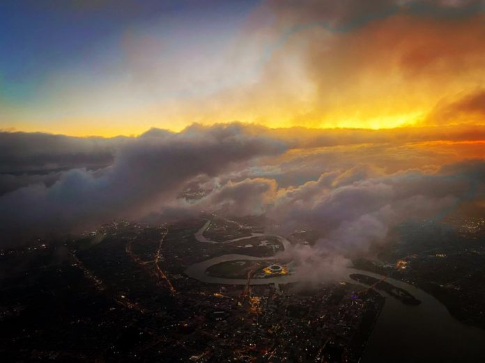 View of clouds and sunshine as seen from a plane
