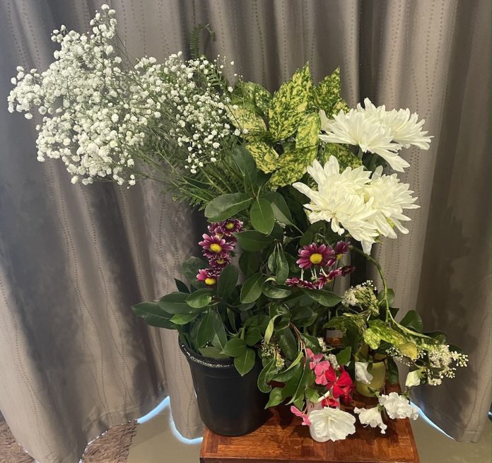 A variety of flowers and leaves picked from my garden along with bought white Chrysanthemums and a bunch of Baby’s Breath flowers.