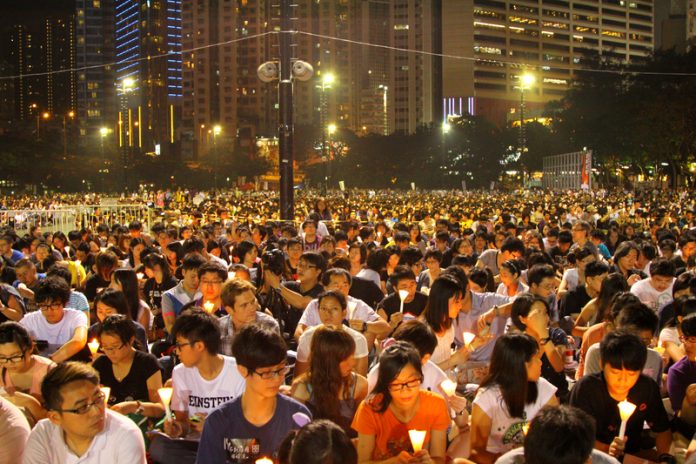 Beyond race and boundaries - The people of Hong Kong mourning June 4th, as they have done faithfully for the past 32 years.