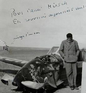 Antoine de Saint-Exupéry standing next to his plane after it crashed in the Sahara Desert in 1935.