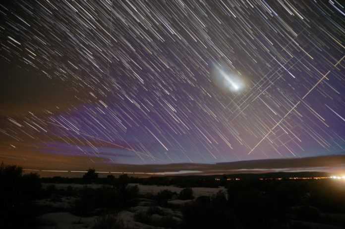 Trails across the night sky from Starlink satellites as captured by time lapse photography.