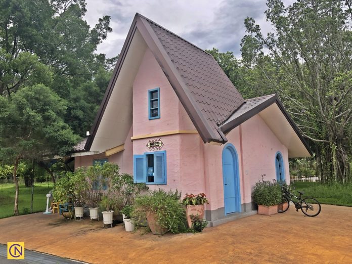 The pink building with a triangular roof is the Rosa Hill information center.