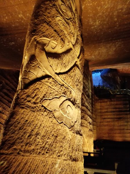 A carved pillar in the Longyou Grotto caves in China.
