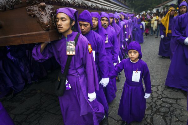 men wearing purple robes during holy week
