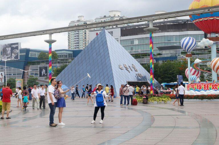 Asian tourists at the "Window of the World" scenic area in Shenzhen, China.