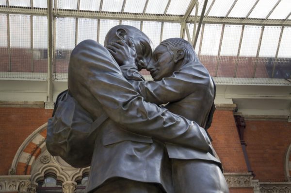 The Embracing Couple statue by Paul Day at the Meeting Place St. Pancras International Railway Station, London, England.