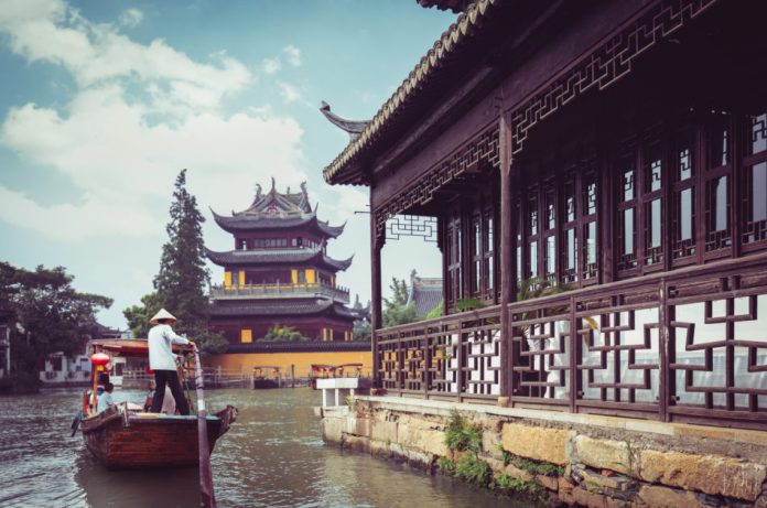 China traditional tourist boats at Zhujiajiao town with boat and historic buildings near Shanghai, China.