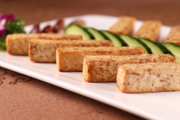 Image by qq53536283 from Pixabay Rectangle chunks of fried taro placed neatly on a white plate with cucumber.