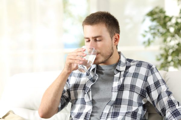 man drinking water
