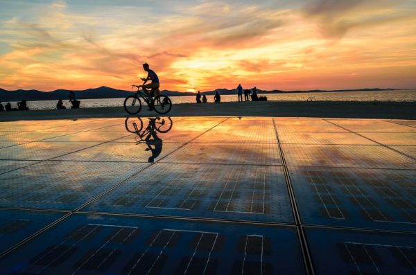 People gathered to watch the sunset at the Sea Organ in Zadar, Croatia.
