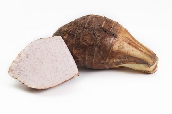 Image by Varintorn Kantawong from Pixabay The taro corm has been cut in half and you can see it is hard and white on the inside and has flecks of purple scattered through the corm. The taro corm behind it has not been cut and show the rough skin. The taro corm rough skin centre and leaves are poisonous if eaten not cooked. Taro corm must be peeled and cooked before eating.