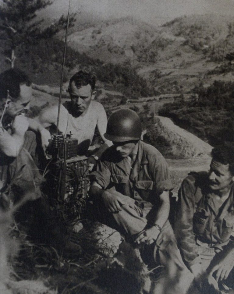 Korean War — 60th Anniversary Photo Archive — soldiers listening to a radio at Chosin Reservoir.