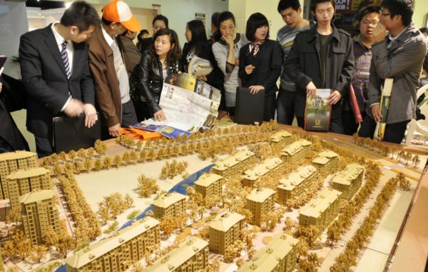 Potential home buyers at a real estate fair in China.