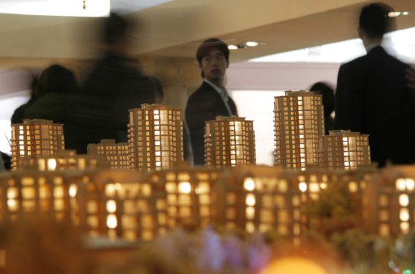 People attending a real estate fair in Jiaxing, China.