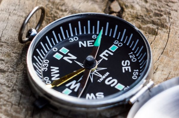 A magnetic compass indication the right direction of the earth`s north pole.