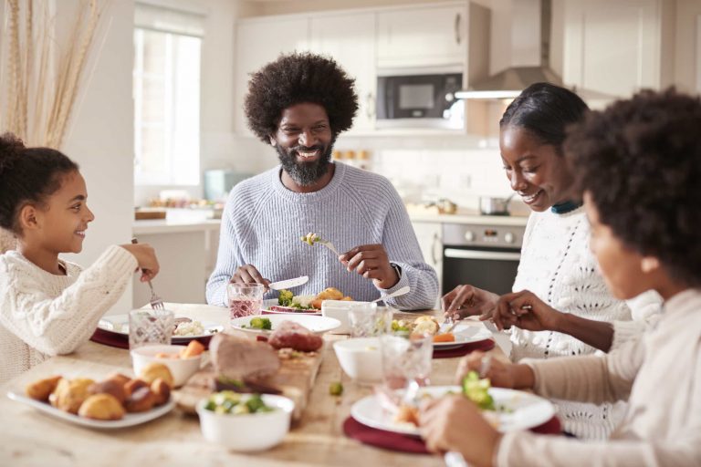 African American family having dinner together.