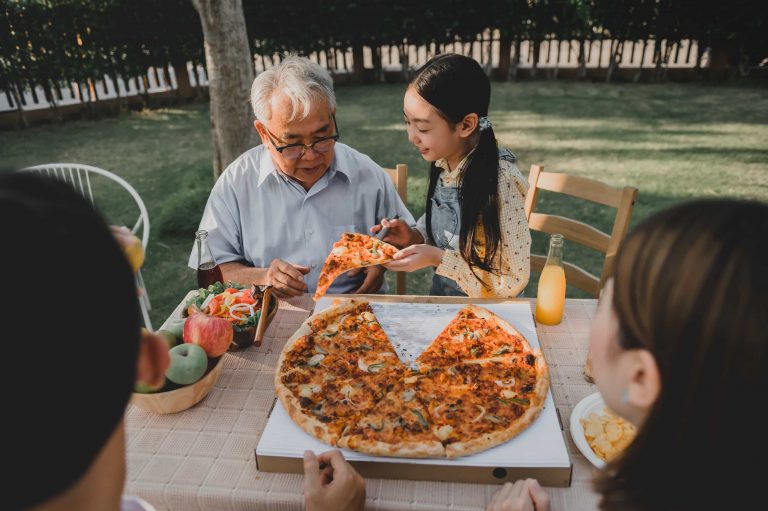 Chinese family sharing a pizza.