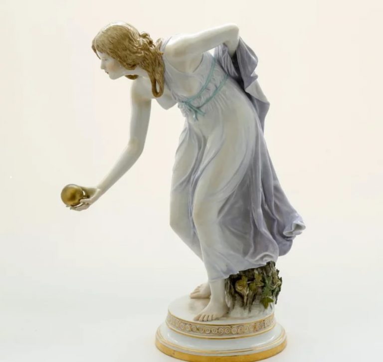 Meissen porcelain figurine of a woman.