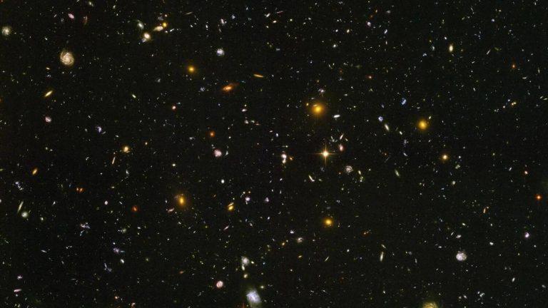 This image made from a composite of September 2003-January 2004 photos captured by the NASA/ESA Hubble Space Telescope shows nearly 10,000 galaxies in the deepest visible-light image of the cosmos, cutting across billions of light-years.