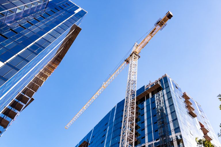 Crane and skyscrapers under construction in San Jose, South San Francisco Bay Area.