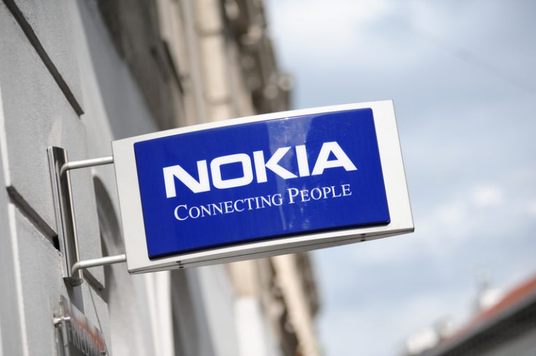 Blue and white Nokia sign on a building with the slogan "Connecting People".