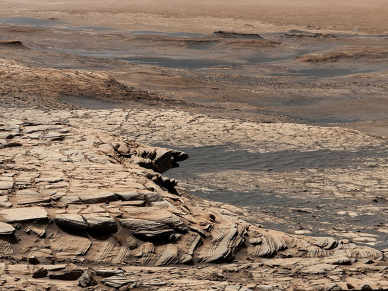 Stitched together from 28 images, this view from NASA's Curiosity Mars rover was captured after the rover ascended the steep slope of a geologic feature called "Greenheugh Pediment."