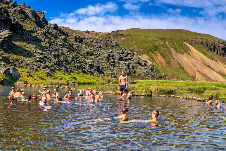 Landmannalaugar hot springs with tourists in Iceland.