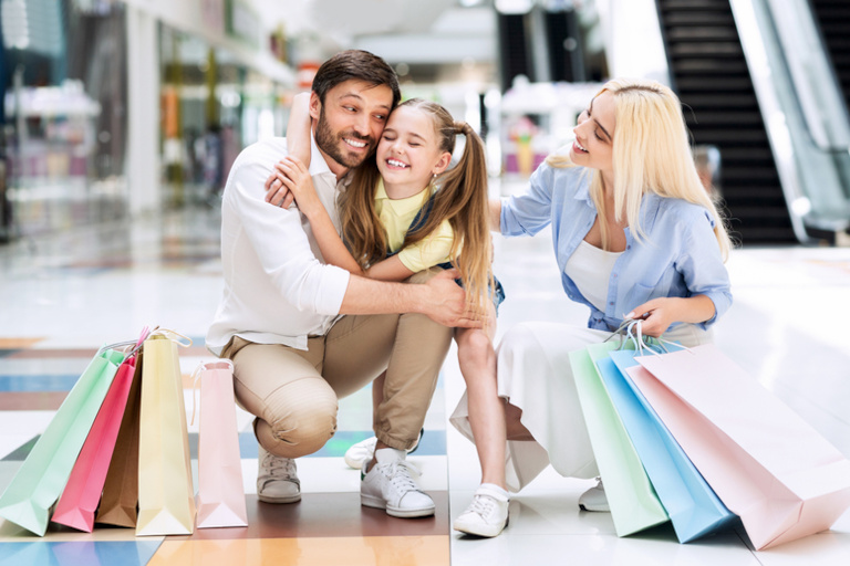 A loving family out shopping.