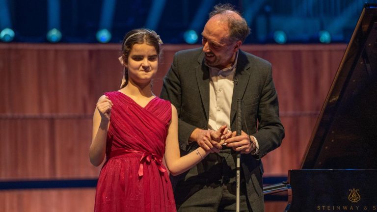 Pianist Lucy with Daniel Bath, her piano teacher, at the Royal Festival Hall.