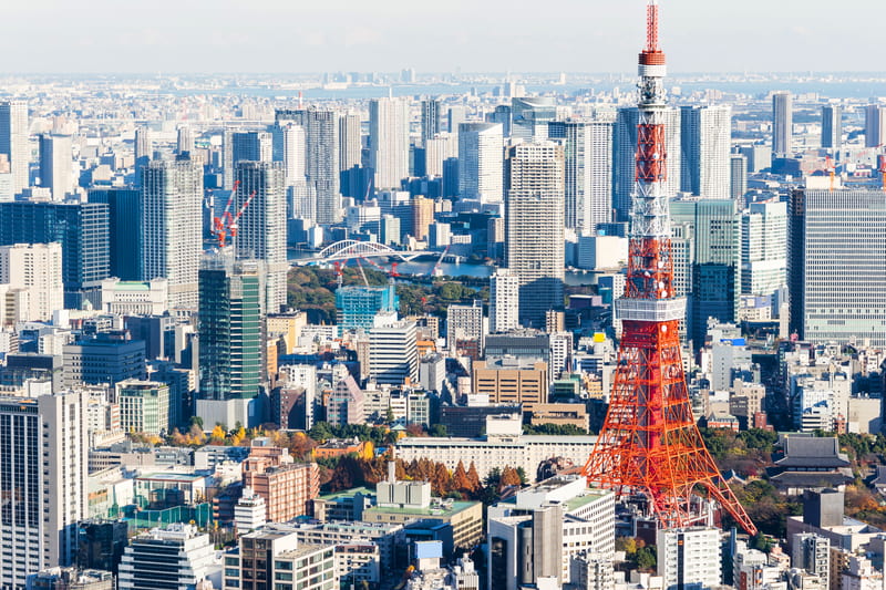 Skyline of Tokyo showing Tokyo Tower and other city buildings.