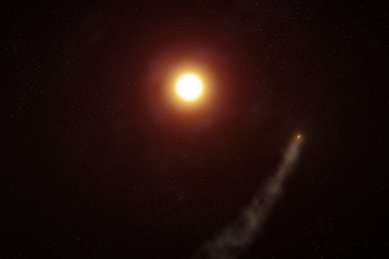 Artist interpretation of an aerial view of the exoplanet WASP-69b on its 3.8-day orbit around its host star. Its atmosphere is being stripped away and sculpted into a long cometlike tail that trails the planet.