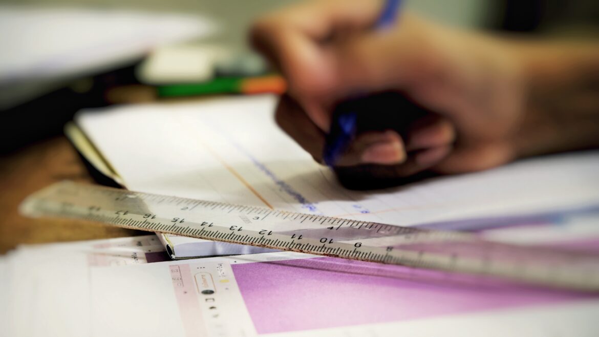 A student writing in a notebook.