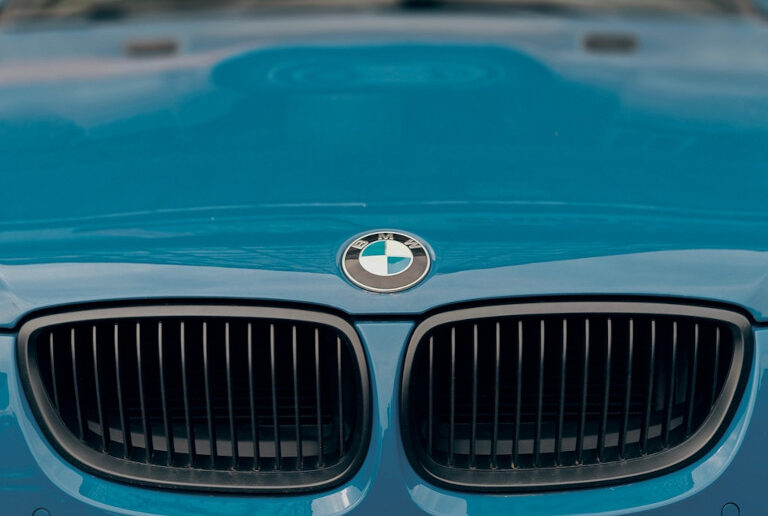 Grille of a baby blue BMW.